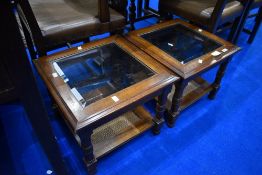 A pair of modern stained frame square occasional tables with glass top and cane undertier, approx 46
