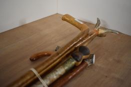 A selection of six walking canes and sticks two with antler tops