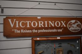 A shop display sign of ' VICTORINOX' makers of swiss army knives