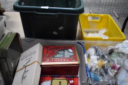 A collection of fly tying equipment and supplies including feathers line hooks and cotton