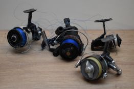 Four spinning reels a Shakespeare noris 2030, a catcher 40, a profish 100 and an Abu Cardinal 77x