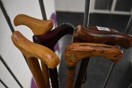 A selection of six wooden walking sticks with wooden handles Average length is 90cm