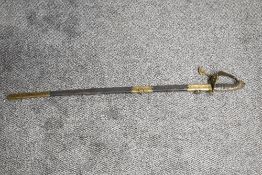 A British Royal Navy Officers Sword by Colwill Forest Devonport, decorated blade, lion head