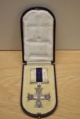 A George V Military Cross in original box with ribbon, unnamed, The Military Cross was instituted in
