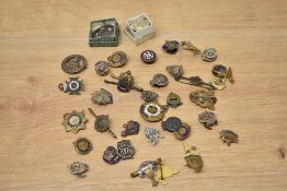 A small tin of Military Badges, many regiments seen