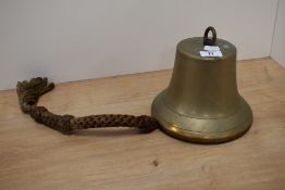 An early 20th Century brass maritime bell, with rope handle