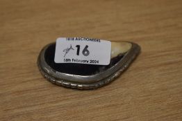 A 19th Century white metal engraved snuff box, in the form of a polished mussel shell, measuring 7cm