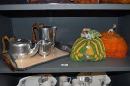 Two vintage porcelain tea cosy dolls, both measuring approximately 22cm tall, and a mid-20th Century