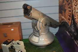 An unusual coin operated grey painted tourist viewing telescope
