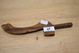 A 19th Century carved wood knitting stick, measuring 25cm long