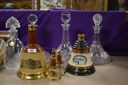 A selection of Bells whisky collectables and four cut glass decanters.