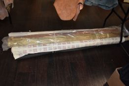 A variety of part rolls of lining and upholstery fabrics.