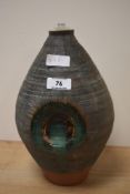 A mid-20th Century studio pottery lamp base, with drip glazed decoration, and impressed mark to