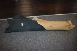 A roll of black leather, possibly pig skin.