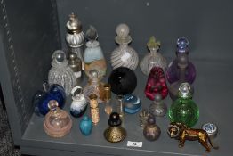 A mixed lot of glass, including perfume bottles and paper weights, including Caithness bottle with