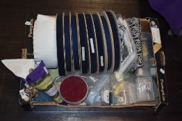 A box full of haberdashery, tape edging, thread, scissors etc.