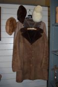 Two sheepskin coats, two mink hats and a sheepskin hat with large bobble.