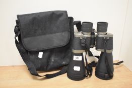 A pair of Tasco zip focus fully coated 101BRZ/C 30 X 60 binoculars, with case.