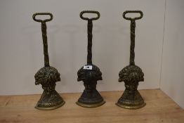 Three 19th/ early 20th century brass door porters in the form of Wheatsheafs / Corn stooks.