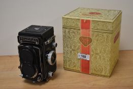A vintage Rolleiflex camera, with original box.