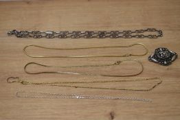 A silver necklace having moulded links with spacers and a box and tongue clasp, a silver chain, an