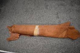 A collection of pieces of tan leather.