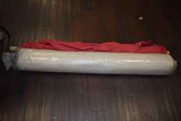 Two rolls of velvet material one beige and part roll of red AF