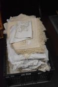 An assortment of table linen and place settings etc.