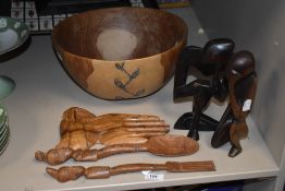 Two 20th Century African hardwood figural ornaments, measuring 23cm tall, a rustic hardwood salad