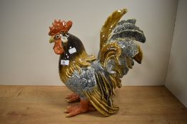 A 20th Century glazed pottery cockerel ornament, SL Rollam Designs, with some damage to the sickle