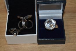 Three Scandinavian silver rings, including rock crystal by Karl Laine, Norwegian double loop ring