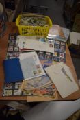 A variety of stamps and first day covers and a selection of Brooke Bond tea cards.