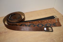 Five gents leather belts, some with embossed decoration, including acorn and oak leaf design.