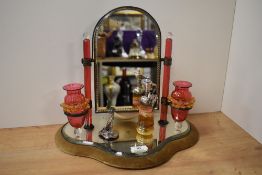An early-mid-20th Century dressing table mirror, raised on a mirrored shaped base, having sconces