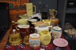 A selection of breweriana, including Crawfords Scotch Whisky jug, Bells whisky bell formed bottle,
