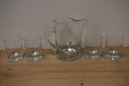 A 20th Century clear glass lemonade set, of Whitefriars style, the jug with a pinched top, and
