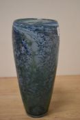 An art glass vase with blue tones with adventurine inclusions.
