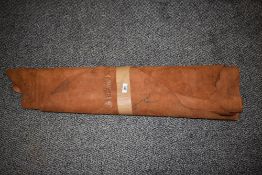 A collection of pieces of tan leather, for crafts and projects.