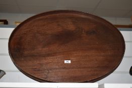 A large Edwardian mahogany butlers tray of oval form.