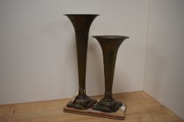 Two vintage brass locomotive horns.