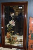 A bevelled glass mirror in wood frame, having hand painted floral design.