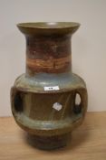 Mo Abaro (1935-2016, Sudanese), a studio glazed pottery vase, having a textured surface covered in a