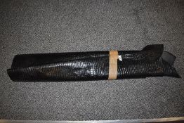 A piece of embossed black leather, suitable for projects etc.