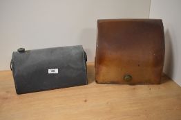 A vintage stone hot water bottle, of sloped form, for carriage or motor car foot well and a metal