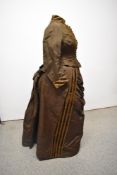 A Victorian brown grosgrain two piece outfit, comprising; bustle back skirt, and boned bodice with