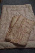 A pair of 1930s pale pink paisley eiderdowns, AF, some fade and displacement of feathers.
