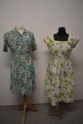 A 1950s textured cotton day dress, having cap sleeves, square neckline, side metal zip and bright