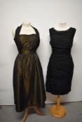 A 1950s iridescent copper/black halter neck dress and a late 1950s/1960s wiggle dress with