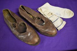 A pair of 1930s brown flat shoes, size 4 and a pair of 1930s silk socks.