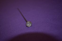 A 'Man in the moon' hat pin, purported to be Rene Lalique, having iridescent glass insert, set in w